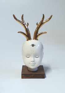 Doll Head, golden deer horn