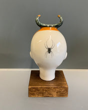 Load image into Gallery viewer, Porcelain doll head steer horn with orange and spider decal
