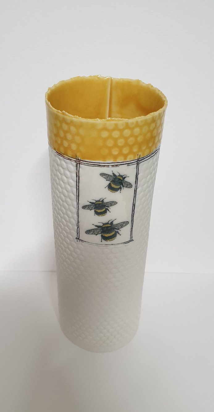 Straight vase with yellow rim and bees