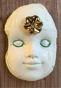 Block head doll face with 24carat gold flower
