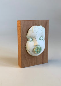 Block Head with green flower